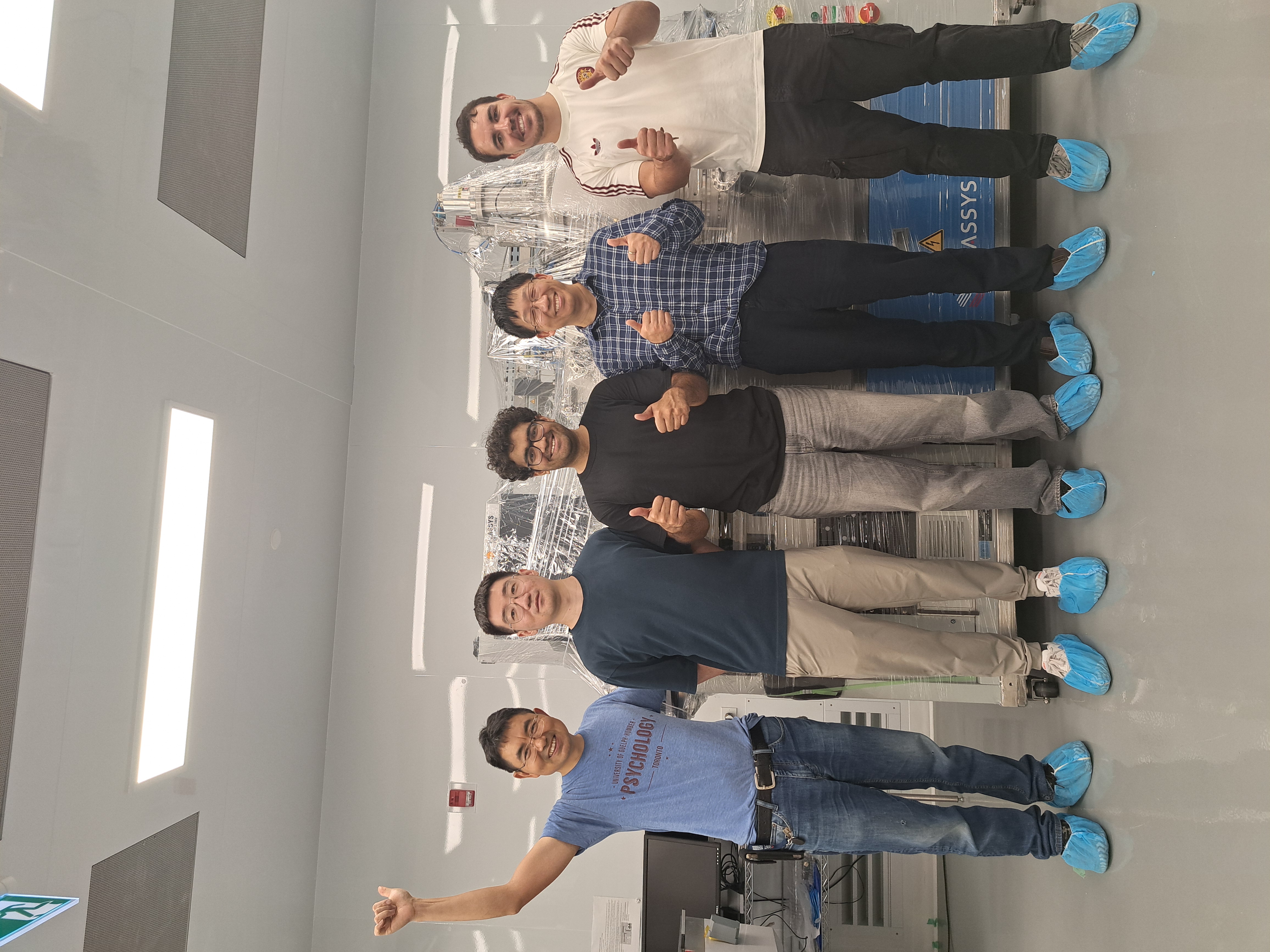 The group celebrates with the Plassys evaporator in the TNFC cleanroom.